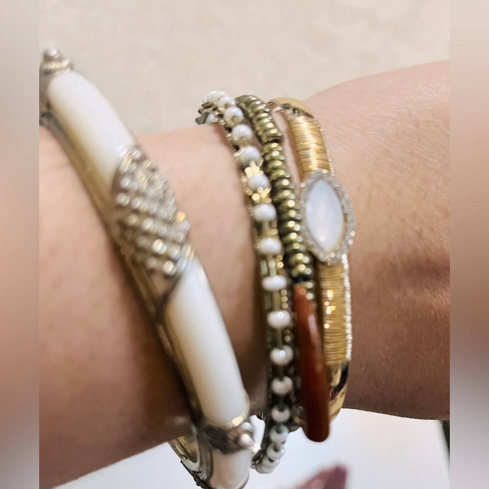 Bundle of four gold bangle bracelets